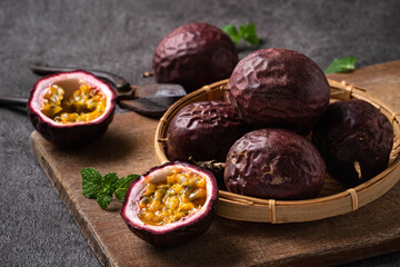Delicious juicy passion fruit on gray table background.