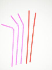 pink and red tubes lie on the table