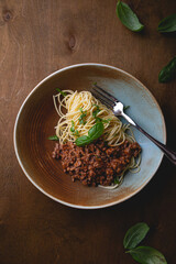 Bolognese pasta with fresh basil