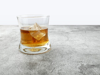 Cola drink in glass on stone background