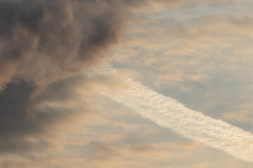 Scattered clouds at sunset golden sky
