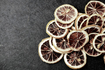 close up of dry lemon on a black background 