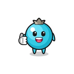 blueberry mascot doing thumbs up gesture