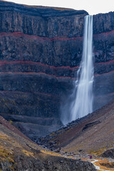 Hengifoss waterfall with red lines in the rocks, long exposure
