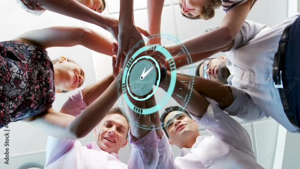 Poster animation of clock over work colleagues stacking hands in background