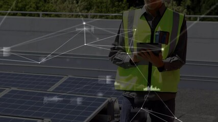 Animation of network of connections over solar panels and male engineer using tablet in background - Powered by Adobe