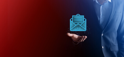 Businessman hand holding letter icon,email icons.Contact us by newsletter email and protect your...