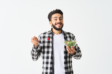 Naklejka premium cheerful man in plaid shirt plate with salad healthy food
