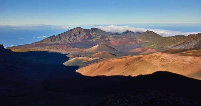 Time lapse of cloud cover at afternoon shadow play at the top of the volcano summit crater at Haleakala National Park which is a massive shield volcano standing at 10,023 feet, Maui, Hawaii, USA