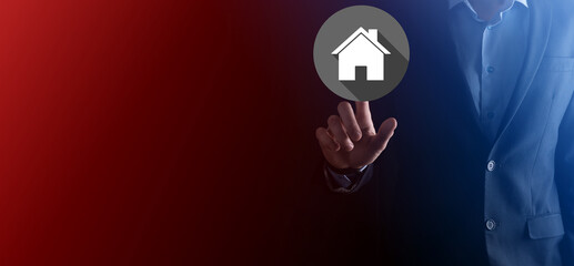 Real estate concept, businessman holding a house icon.House on Hand.Property insurance and security...