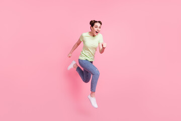 Profile photo of careless crazy pretty lady jump run fast scream wear green t-shirt isolated on pink background