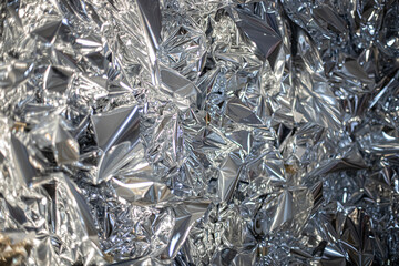 Christmas shiny silver foil texture background. Macro.