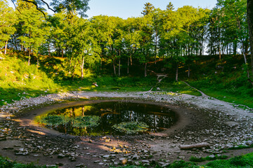 Kaali field of meteorite craters in Saaremaa, Estonia during sunny summer morning