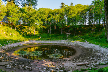 Kaali field of meteorite craters in Saaremaa, Estonia during sunny summer morning