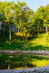 Kaali field of meteorite craters in Saaremaa, Estonia during sunny summer morning