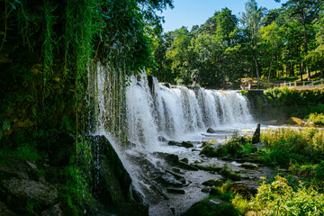 Keila waterfall located on Keila River in Harju County near Tallinn, Estonia. Water flowing in the middle of the forest
