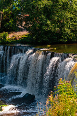 Keila waterfall located on Keila River in Harju County near Tallinn, Estonia. Water flowing in the middle of the forest