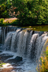 Keila waterfall located on Keila River in Harju County near Tallinn, Estonia. Water flowing in the middle of the forest