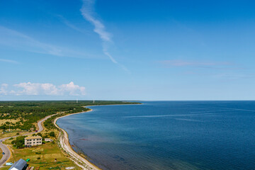 Aerial shot of the Sorve peninsula by the Baltic sea from the Sorve lighthouse in Saaremaa, Estonia. Clear blue sky, calm weather