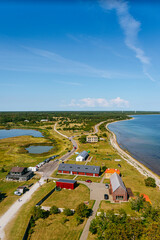 Aerial shot of the Sorve peninsula by the Baltic sea from the Sorve lighthouse in Saaremaa, Estonia. Clear blue sky, calm weather