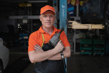 Mechanic changing engine, service car workshop automobile. professional man shop maintenance