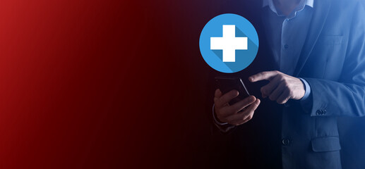 Obraz premium Businessman hold plus icon, man hold in hand offer positive thing such as profit, benefits, development, CSR represented by plus sign.The hand shows the plus sign.flat icons with long shadows