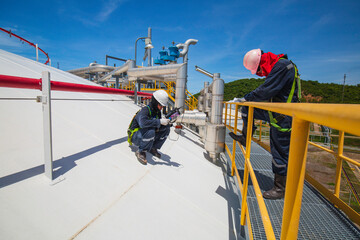 Male two worker are for inspection ultrasonic thickness roof plate top