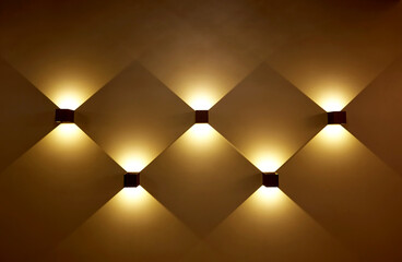 Gold illuminated wall as a background.