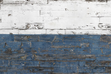 Abstract wood texture. Vintage textured background of old dirty wooden planks with peeling paint. Blue and white paint on old wooden fence
