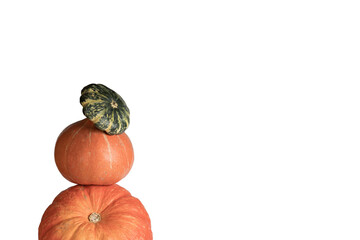 Pumpkin and patison set in the shape of a pyramid on a white background, a creative concept of...