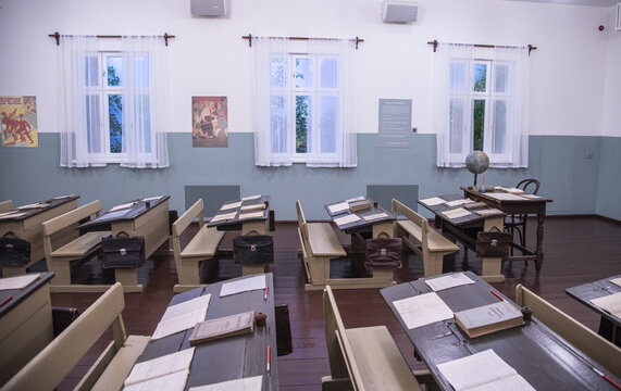 School class. Antique desks with textbooks and notebooks.