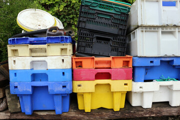 plastic fish containers stacked on land