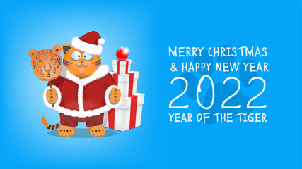 Festive poster or postcard, Merry Christmas and Happy New Year 2022. Fat funny red cartoon cat Santa Claus with a tiger mask on the background of large gift boxes and red ball toy
