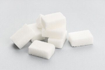 Sugar cubes on gray background. Close up