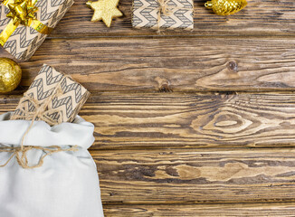 Christmas and New Year gifts with paper envelopes on a wooden background. Place to copy