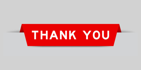 Red color inserted label with word thank you on gray background