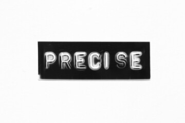 Black color banner that have embossed letter with word precise on white paper background