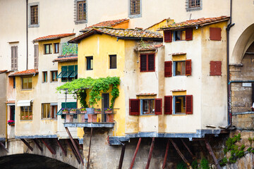 Fototapeta na wymiar Detales of Ponte Vecchio, Florence, Italy. Windows, balconies, flowers