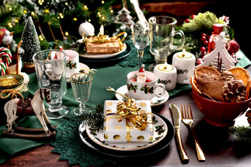Christmas table setting with decors and green tablecloth