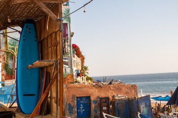surfing boards shelved in front of beach
