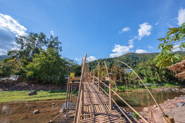 Landscape view of mountains and river on wooden bridge at Boklua Village nan Thailand.Boklua is ancient salt well in thailand .Thailand destination travel