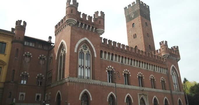 Neo gothic palace. Medici del Vascello neo-Gothic palace in Asti.Building with red brick walls and battlements located in the historic center, in Piazza Roma.  