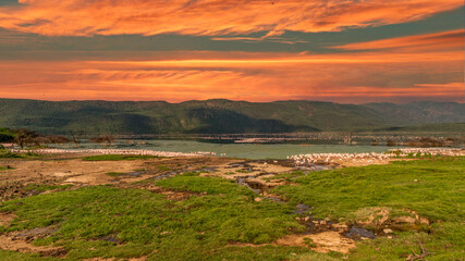 beautiful sunset over the lakes of Baringo with pink flamingos in the foreground