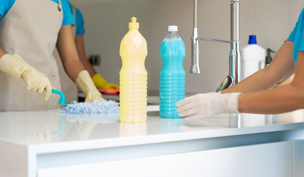 Crop housekeeper bottle of detergent cleaning kitchen