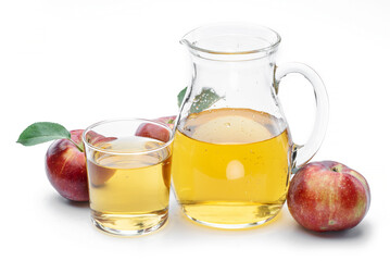 Glass and carafe of fresh apple juice and organic apples isolated on white background.