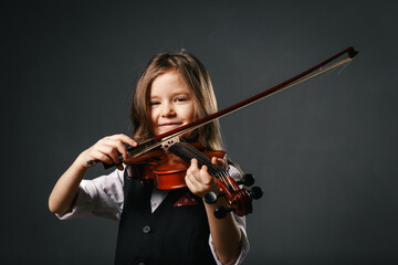 Young girl closeup studio portrait with violin
