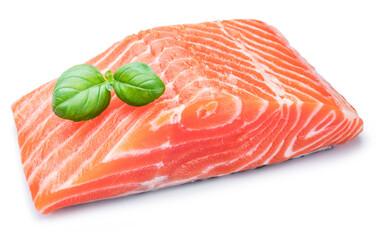 Fresh raw salmon fillet decorated with fresh basil.