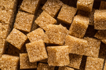 Brown sugar cubes in the paper package. Top view.