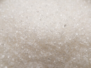 White refined sugar granules close-up. Food background.