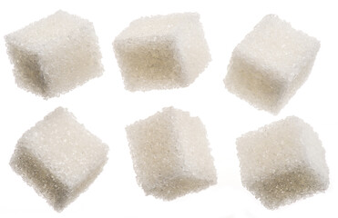 White sugar cubes on white background. Macro picture.